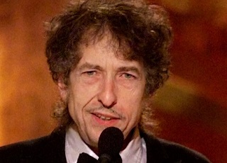 What is Bob Dylan’s real name and why did he change it?