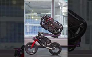 Robot performs stunts on bycicle